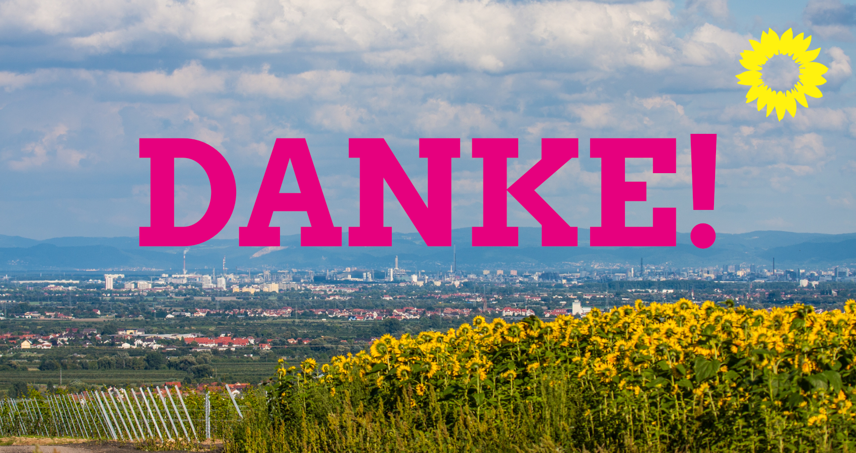 Danke! Schriftzug vor einem Foto des Rhein-Pfalz-Kreises mit Sonnenblumen.